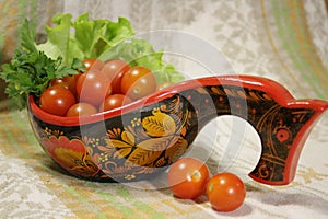 Cherry tomatoes with parsley in Hohloma photo