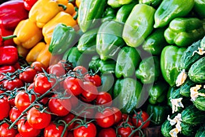 Cherry tomatoes and peppers beautifully situated on a farmer`s market