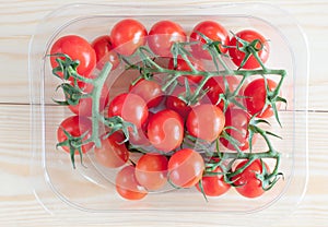 Cherry tomatoes in plastic container