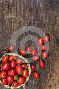Cherry tomatoes ,is a small tomatos on wood top and Basket weave