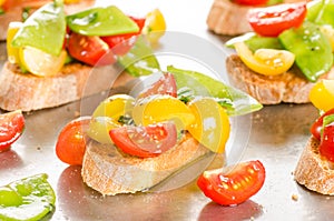 Cherry tomatoes and snow peas crostini