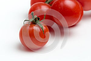 Cherry tomatoes on white background