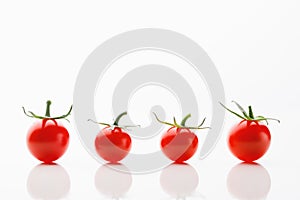 Cherry tomatoes on white background with copy-space