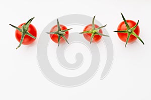 Cherry tomatoes on white background with copy-space