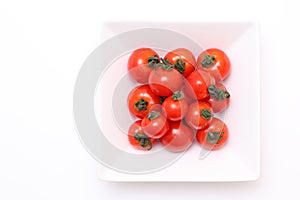 Cherry tomatoes on white plate