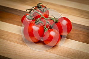 Cherry tomatoes on wooden cutting board
