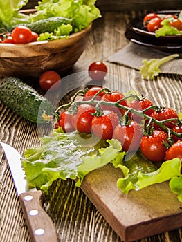 Cherry tomatoes on a wooden rustic background