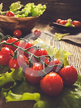 Cherry tomatoes on a wooden rustic background