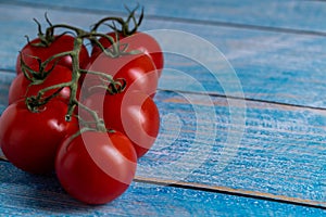 Cherry tomatoes on wooden table