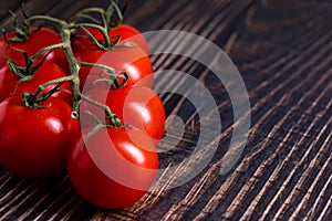 Cherry tomatoes on wooden table