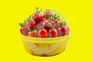Cherry tomatoes on yellow background