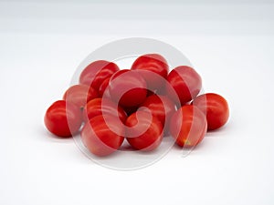 Cherry tomatos on white gray background