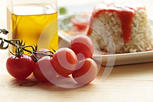 Cherrys tomatoes on wooden background.