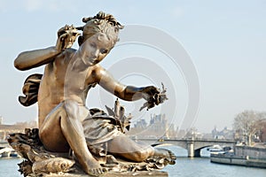 Cherub on Pont Alexandre III bridge in Paris photo