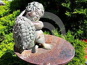 Cherub sleeping hedges library sculpture