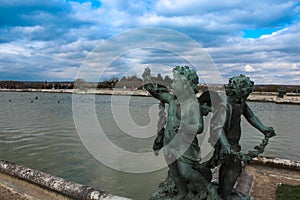 Statues under Blue Sky outside Palace of Versailles photo