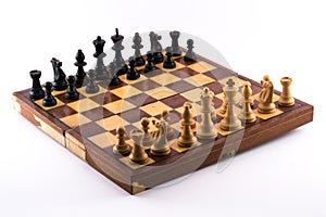 Chess board with black and white figurines on a white background