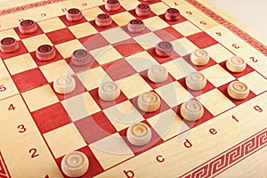 Chess board with checkers during game close up