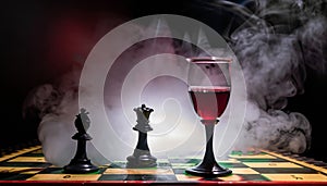 chess board with chess piece and glass of wine