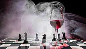 chess board with chess piece and glass of wine
