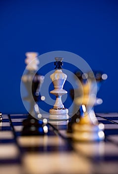 Chess board with chess pieces on blue background. Concept of business ideas and competition and strategy ideas. White and black