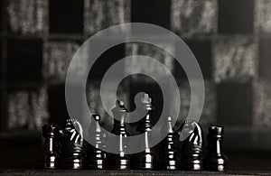 Chess board with chess pieces. Chess on the dark background. Business success concept. Strategy. Checkmate.