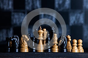 Chess board with chess pieces. Chess on the dark background. Business success concept. Strategy. Checkmate.