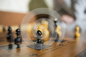 Chess Board close focused on black pawn