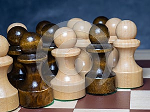 Chess board with figures. Wooden chess. Board games. Location of opponents. Counter strategy. Pawns