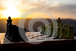 chess board game concept of business ideas and competition and strategy ideas. Chess figures on a chessboard outdoor sunset backgr