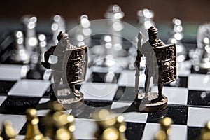 Chess board game concept of business ideas and competition and strategy ideas Chess figures on a dark background with smoke and