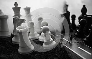 Chess board game concept of business ideas and competition and strategy ideas concep. Chess figures on a dark background with