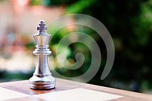 Chess board game. King standing alone at the corner. Business planning and strategy concept