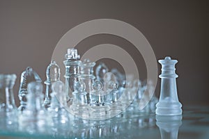 Chess board game made of glass, business competitive concept