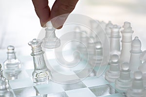 Chess board game made of glass, business competitive concept