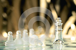 Chess board game made of glass, business competitive concept