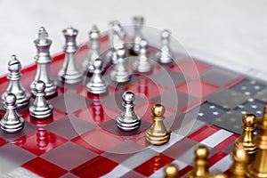 Chess board game pieces on USA and China flag background, trade war tension situation concept