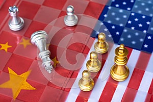Chess board game pieces on USA and China flag background, trade war tension situation concept