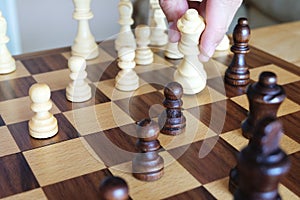 Chess board game. Queen take pawn. Business planning and strategy concept