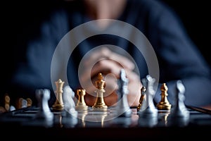 Chess board game between silver team and golden team is stategy game as challange competitive game ,this stategy plan concept with