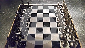 Chess board with metalic figures