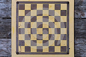 Chess board on an old table in a public park