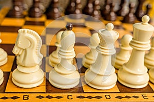 Chess board with starting positions aligned chess pieces