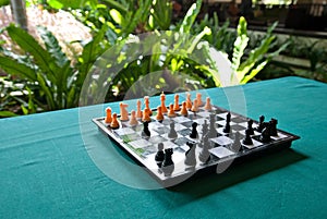 Chess board on table.