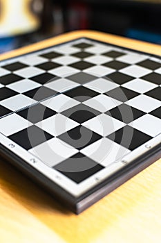 A chess board on a table, Selective focus, Selective focus on subject, background blur