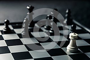 Chess board. White rook threatens black opponent`s chess photo