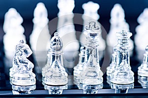 Chess business concept of victory. Chess figures in a reflection of chessboard. Game. Competition and intelligence concept.