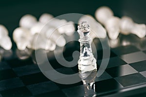 Chess business concept of victory. Chess figures in a reflection of chessboard. Game. Competition and intelligence concept.