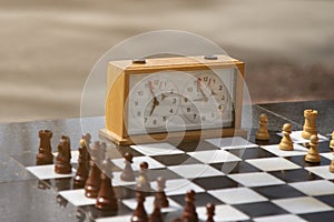 Chess and chess clock outdoors