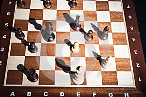 Chess on chessboard. Top view